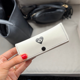 Hand holding Purse Pouch closed 