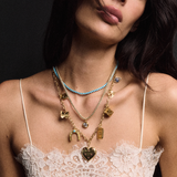 Turquoise Tennis Necklace, Gold Lurex Necklace Cord with Bezel Charm, Chunky Chain with Smiley Face, Butterfly Charm, Law of Attraction Magnet, Heart Vesta Case, Soul or Ego Charm, Cosmic Dice Charm, Bird Charm, and Sapphire Evil Eye