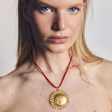 Sun Medallion on Coral Red Necklace Cord