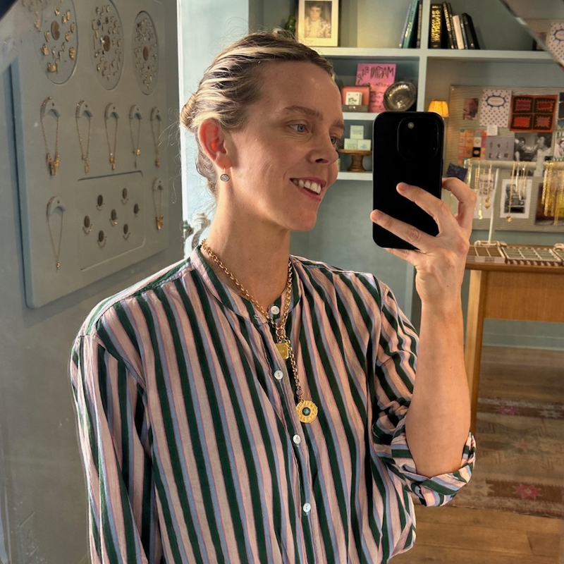 HART founder, Hart Hagerty wearing Rhodium Oval Bezel Drop Earrings and Chunky Rolo Charm Clip Lariat Necklace with Dream Bigger Coin