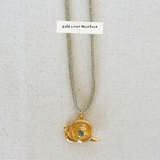 snail charm on gold lurex cord 