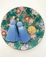 hart cornflower blue topknot tassel earrings in bowl